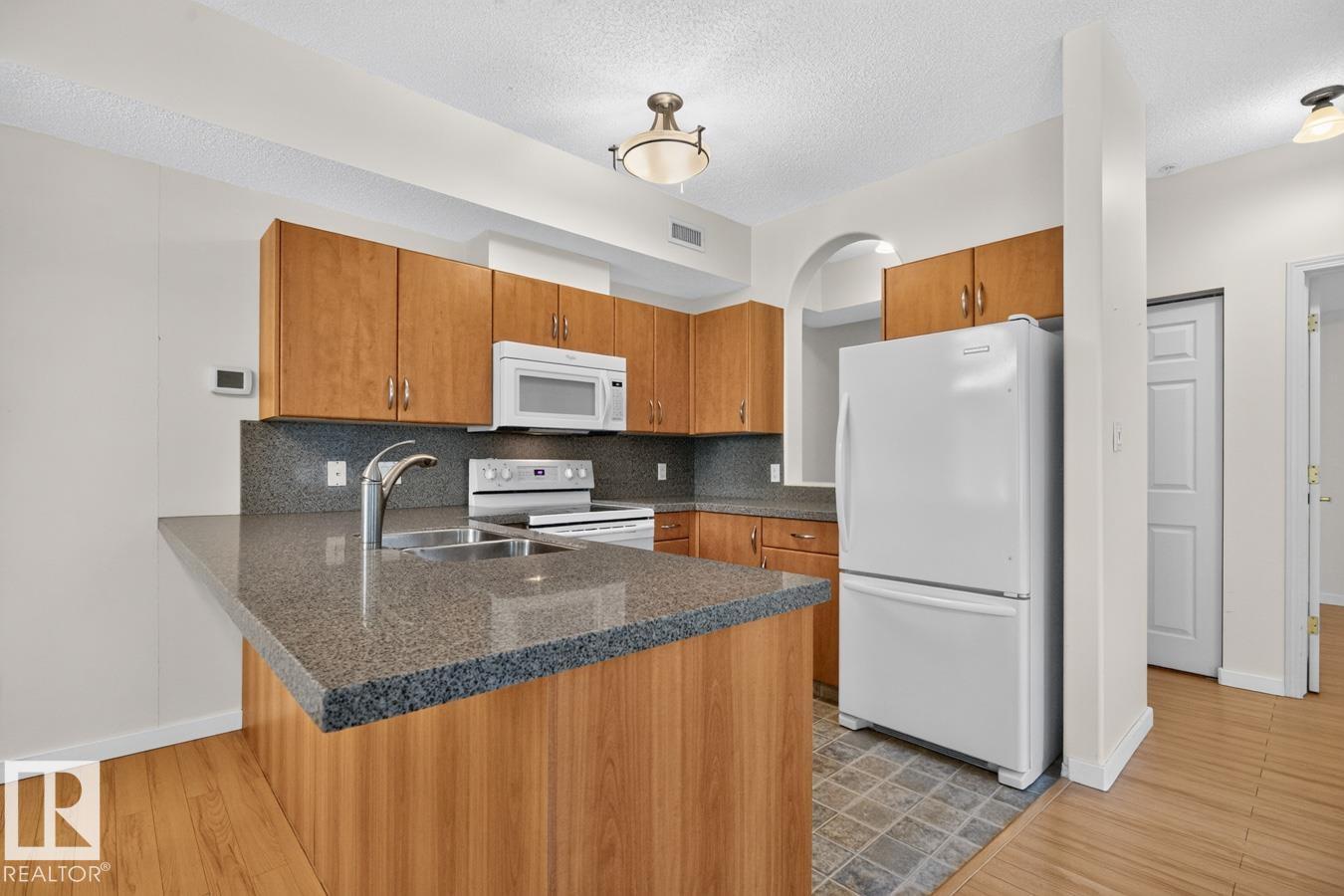 #203 8488 111 ST NW - 11