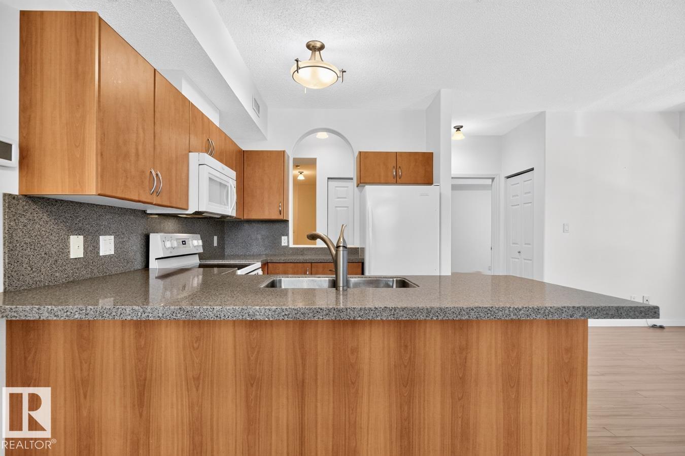 #203 8488 111 ST NW - 13