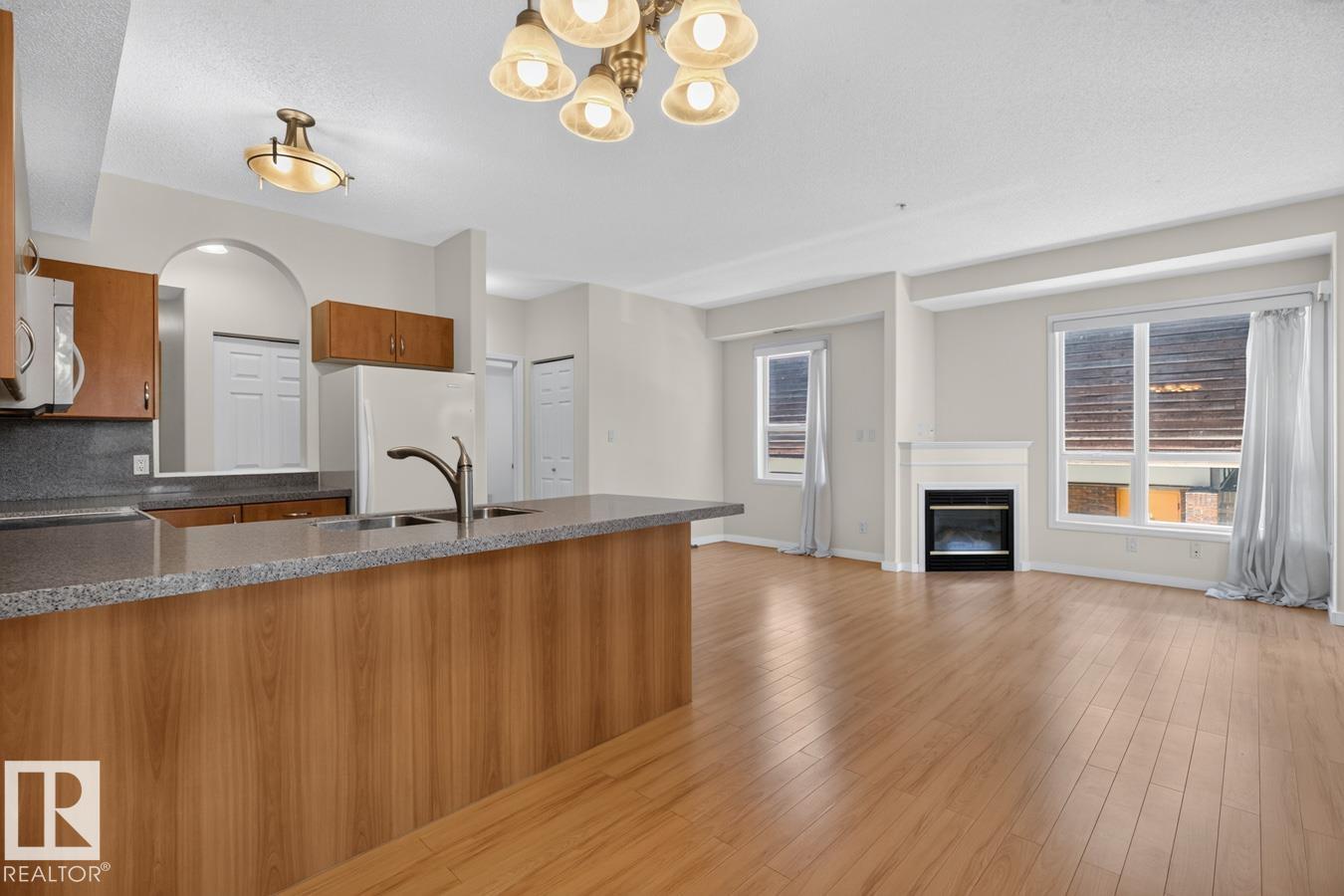 #203 8488 111 ST NW - 18