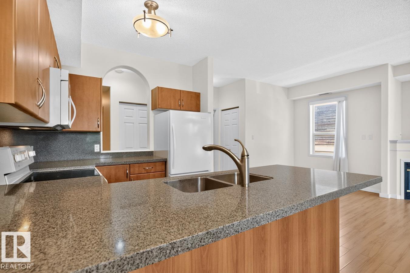 #203 8488 111 ST NW - 12