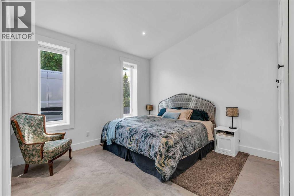 Primary bedroom with vaulted ceilings