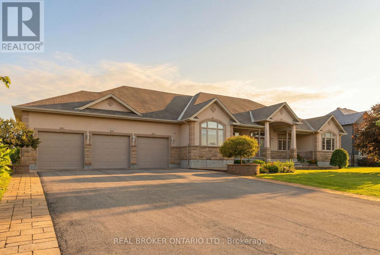 Front view with 3 car garage