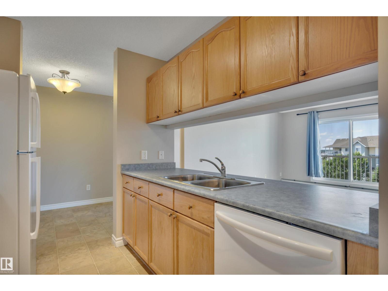 #412 70 WOODSMERE CL - 18