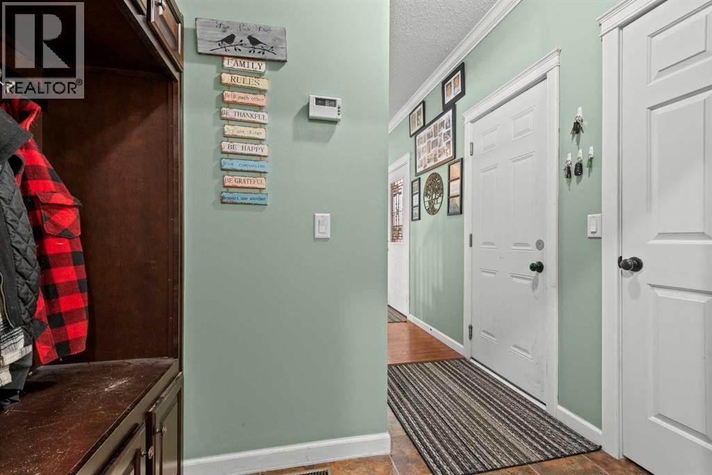 Front Hall to 2pc bath/laundry hookup/utility room