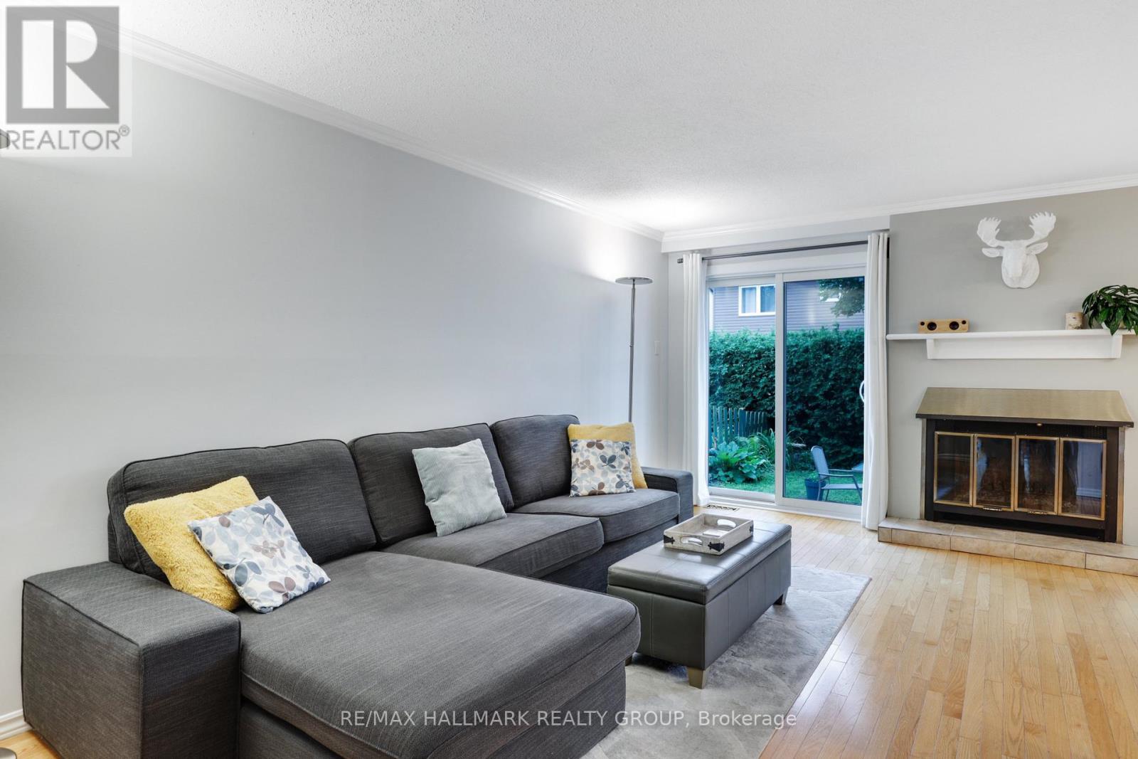 LIVING | cozy wood fireplace,  patio doors to back