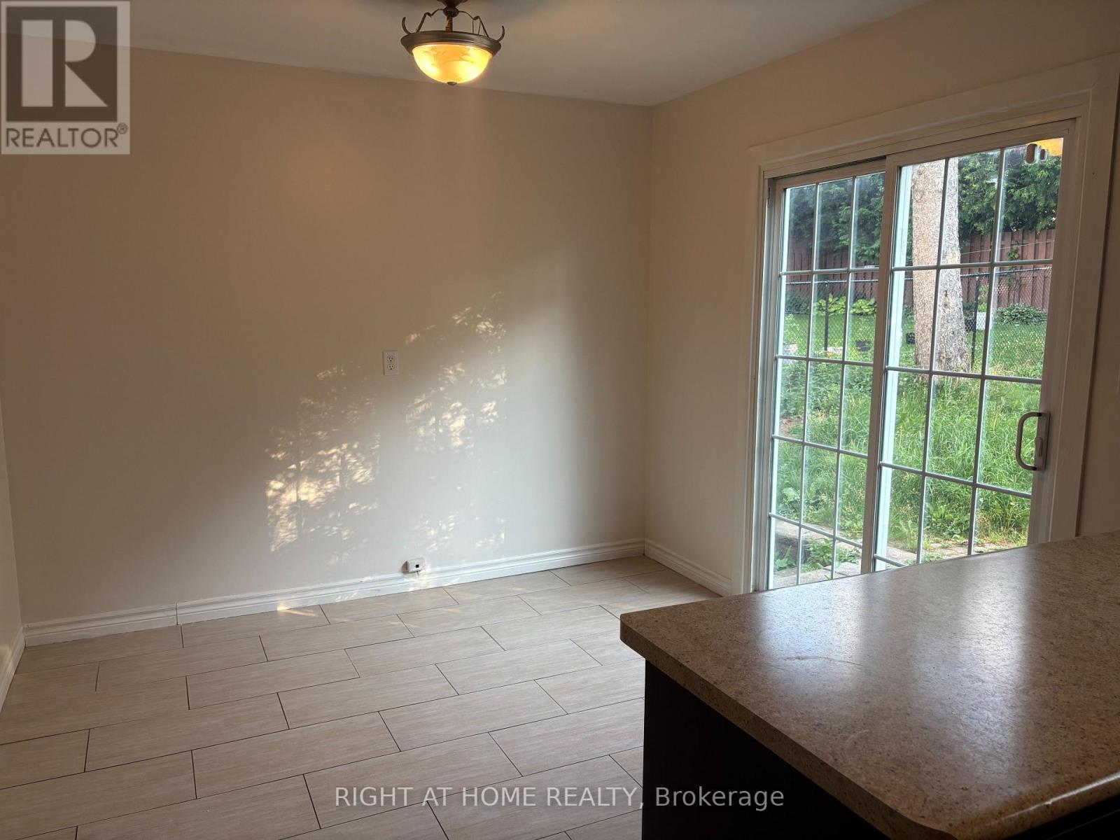 Eat-in Kitchen with Sliding Doors to Backyard