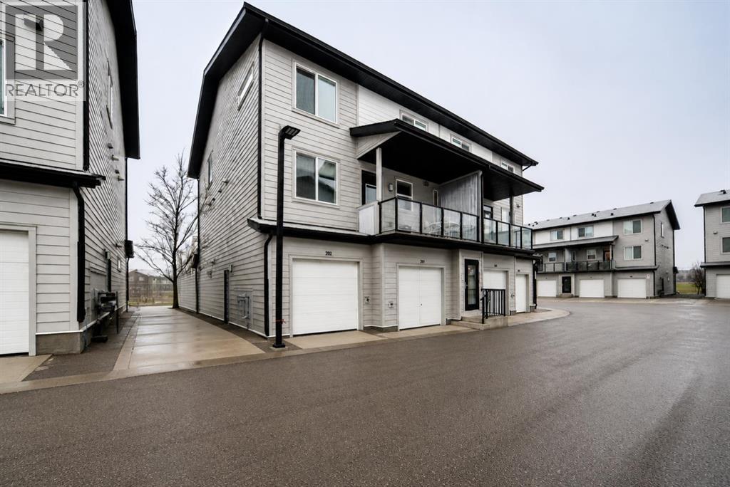 #202 245 Redstone Walk NE - 1