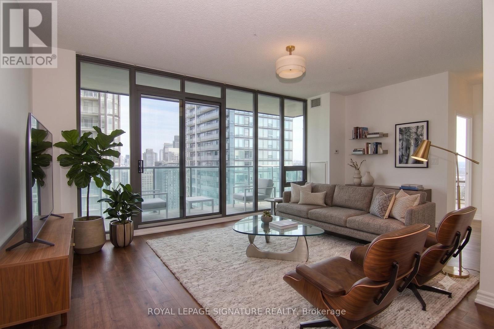 Living room w/ walk-out to balcony