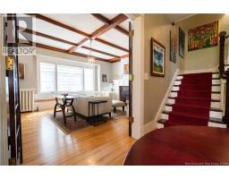 spacious living room with double french doors and bay window