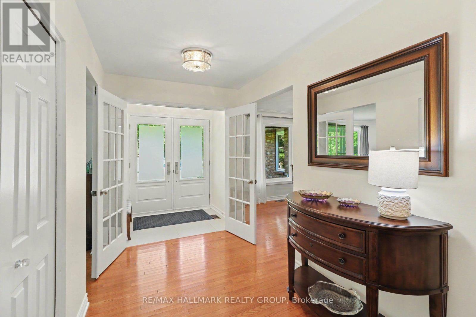 Bright entry, ceramic floors, French doors
