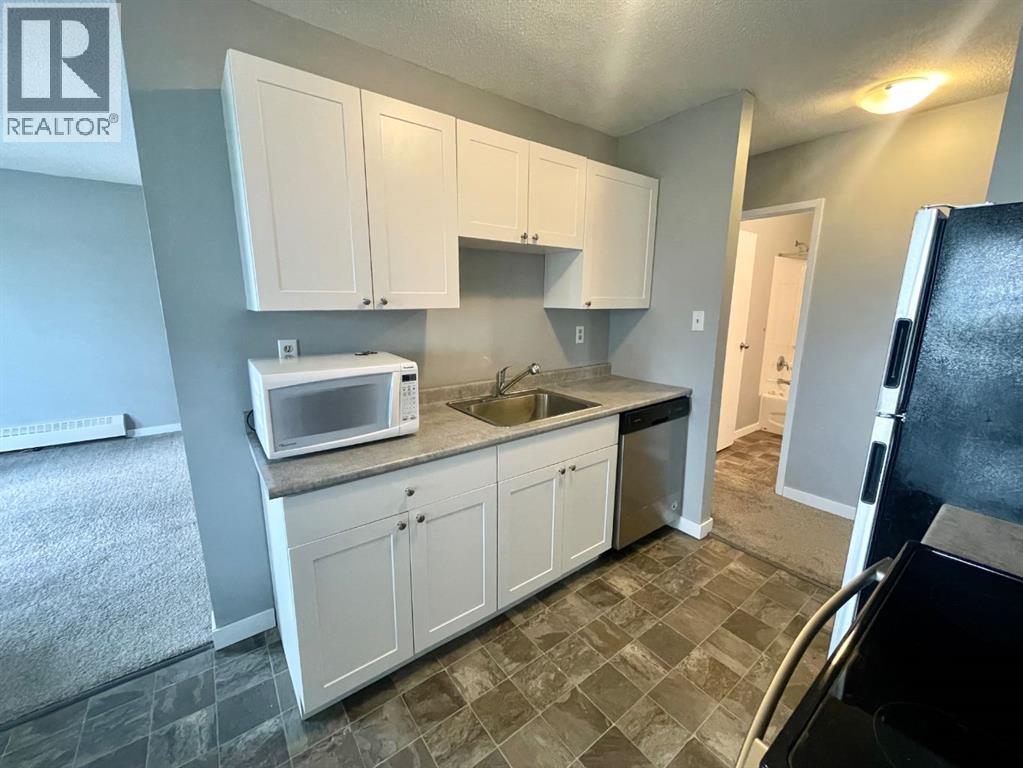 #306B 5611 9 Avenue - 6
