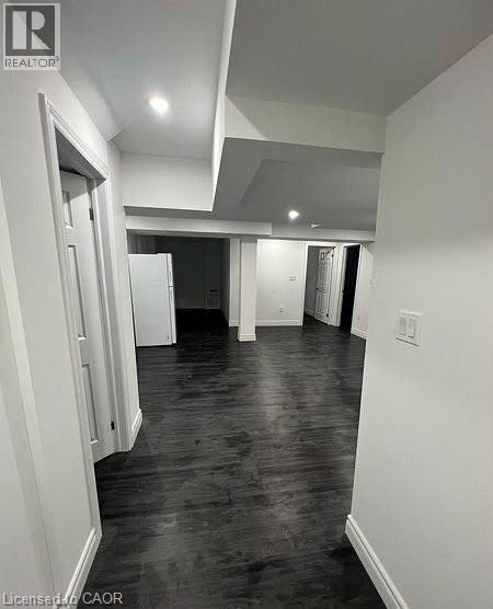 Open interior space with dark wood-finish flooring
