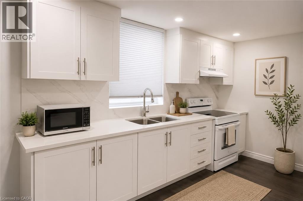 Modern kitchen featuring white shaker-style cabinetry, a double basin stainless steel sink with a gooseneck faucet, white solid surface countertops, and a full-height tile backsplash