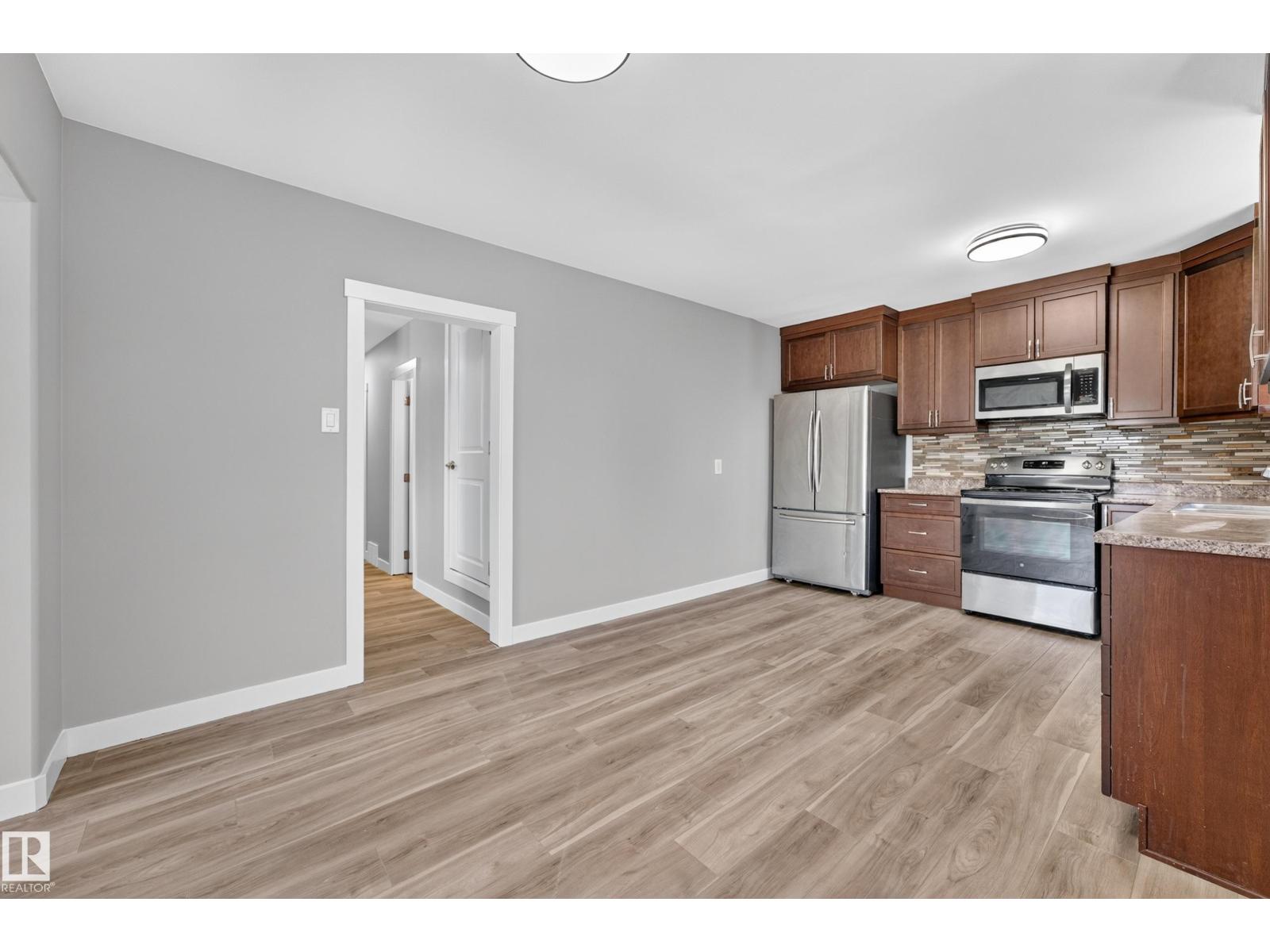 6016 92 AV NW - 7