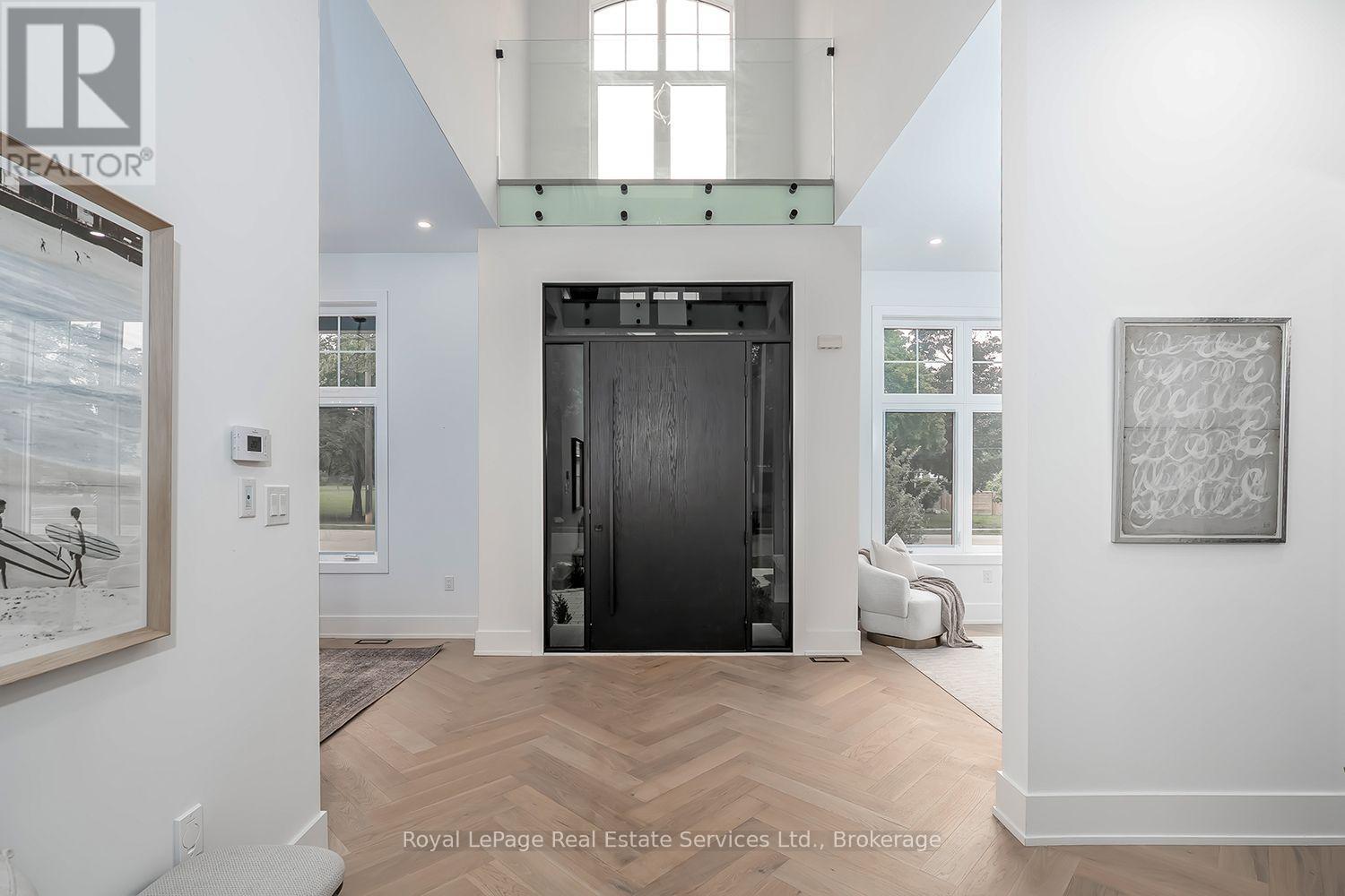 Foyer with ceiling open to above