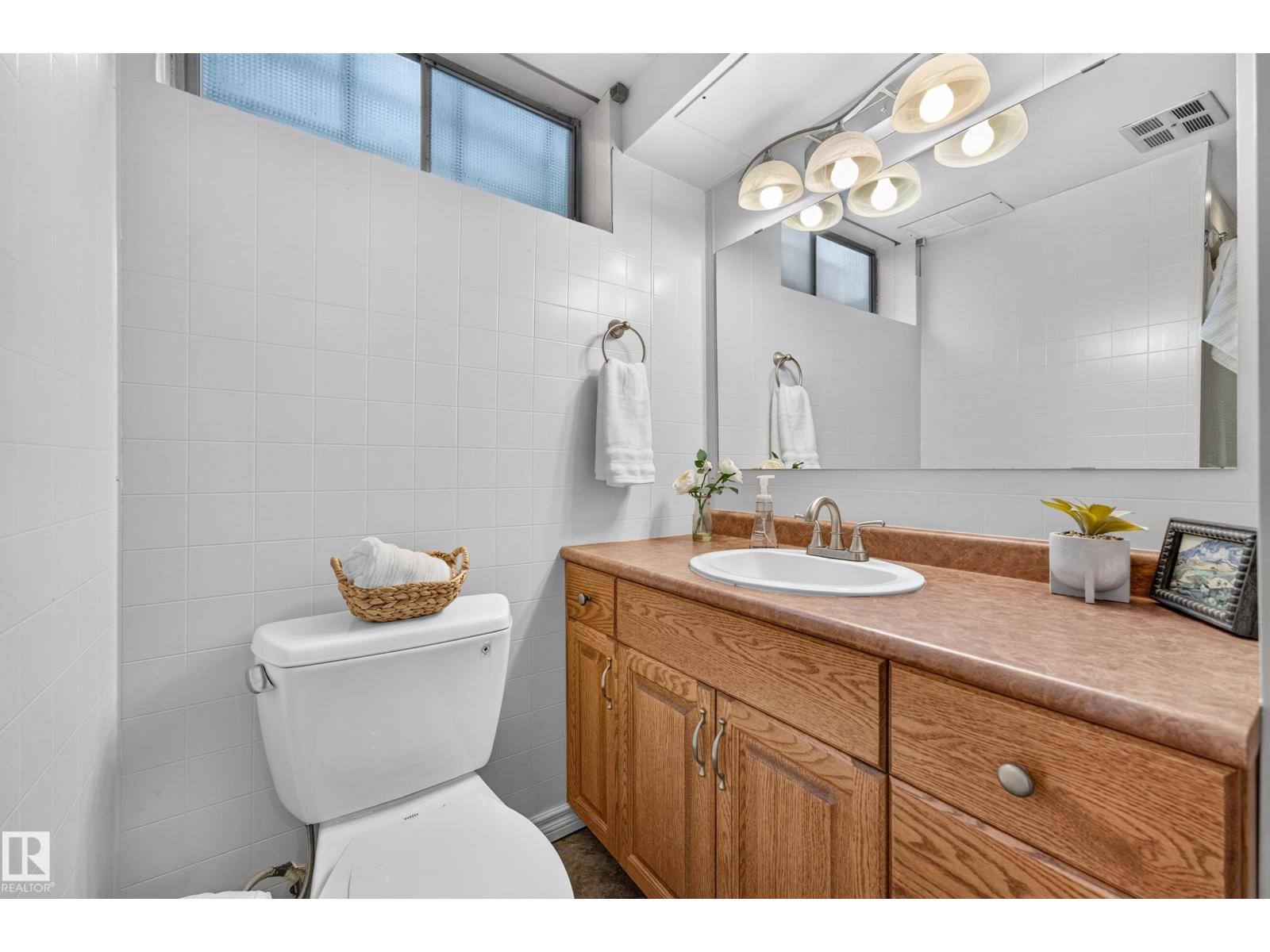 6716 101A AV NW NW - 55
