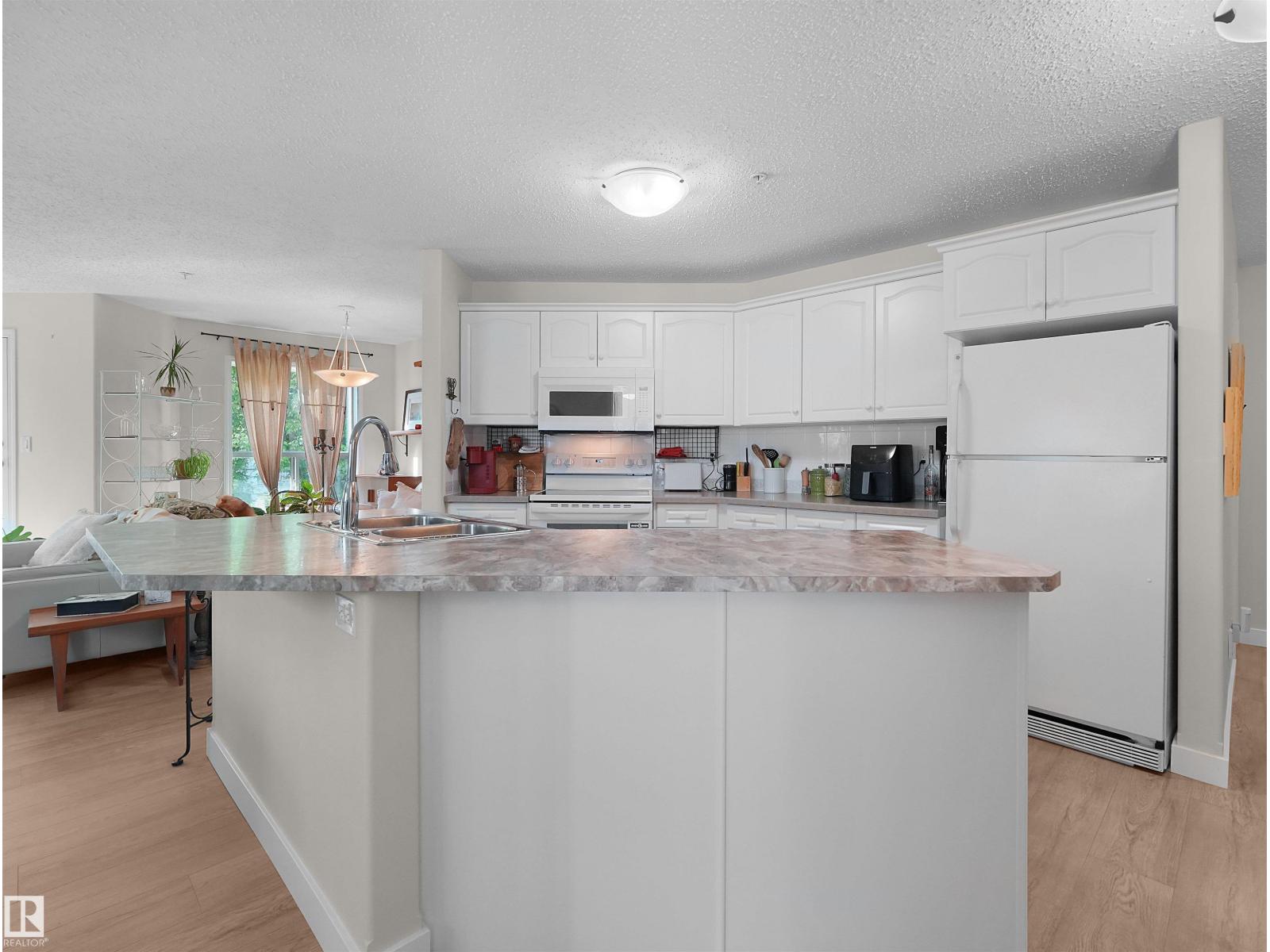 #203 9760 174 ST NW - 9
