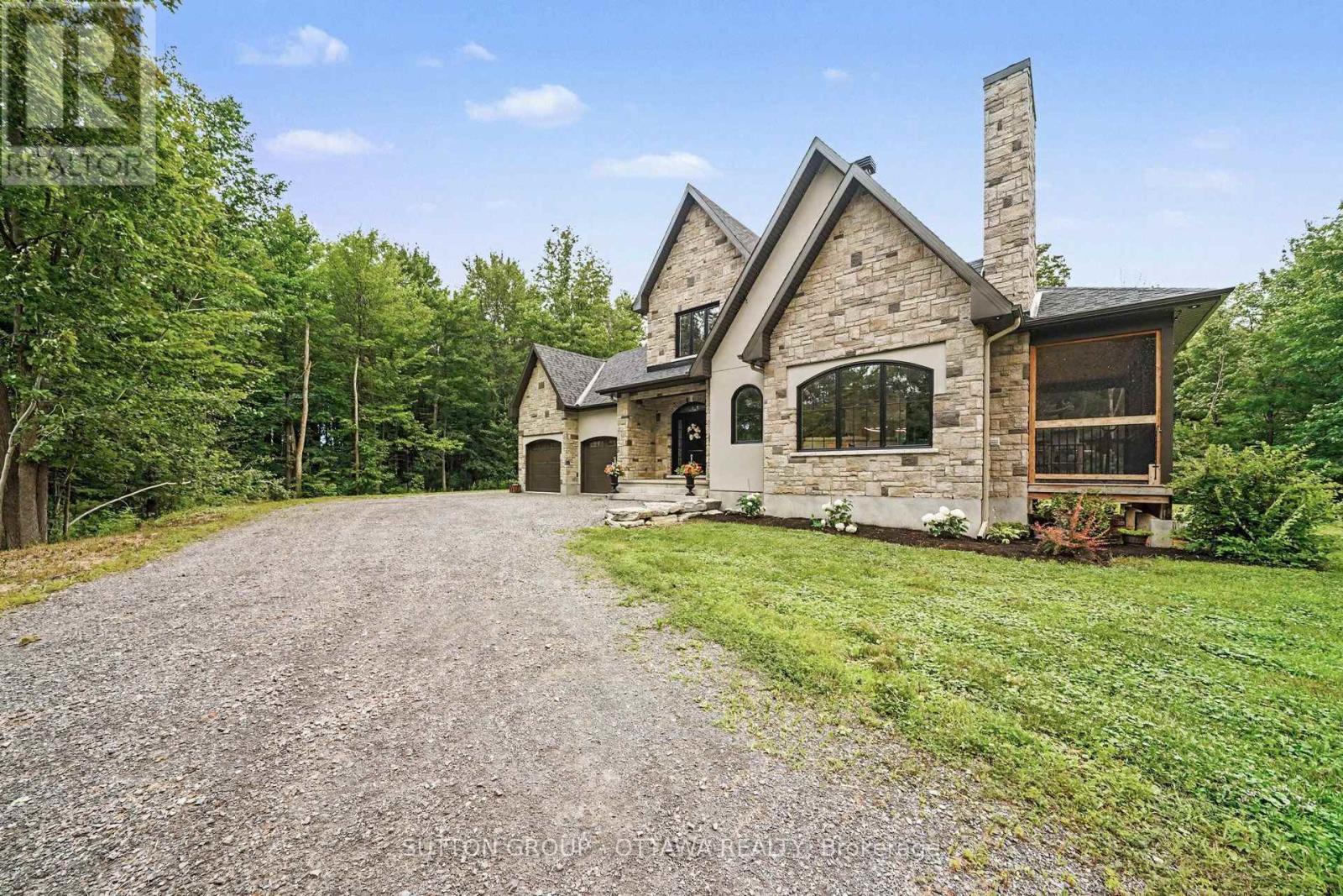 Gorgeous stone exterior facing the driveway