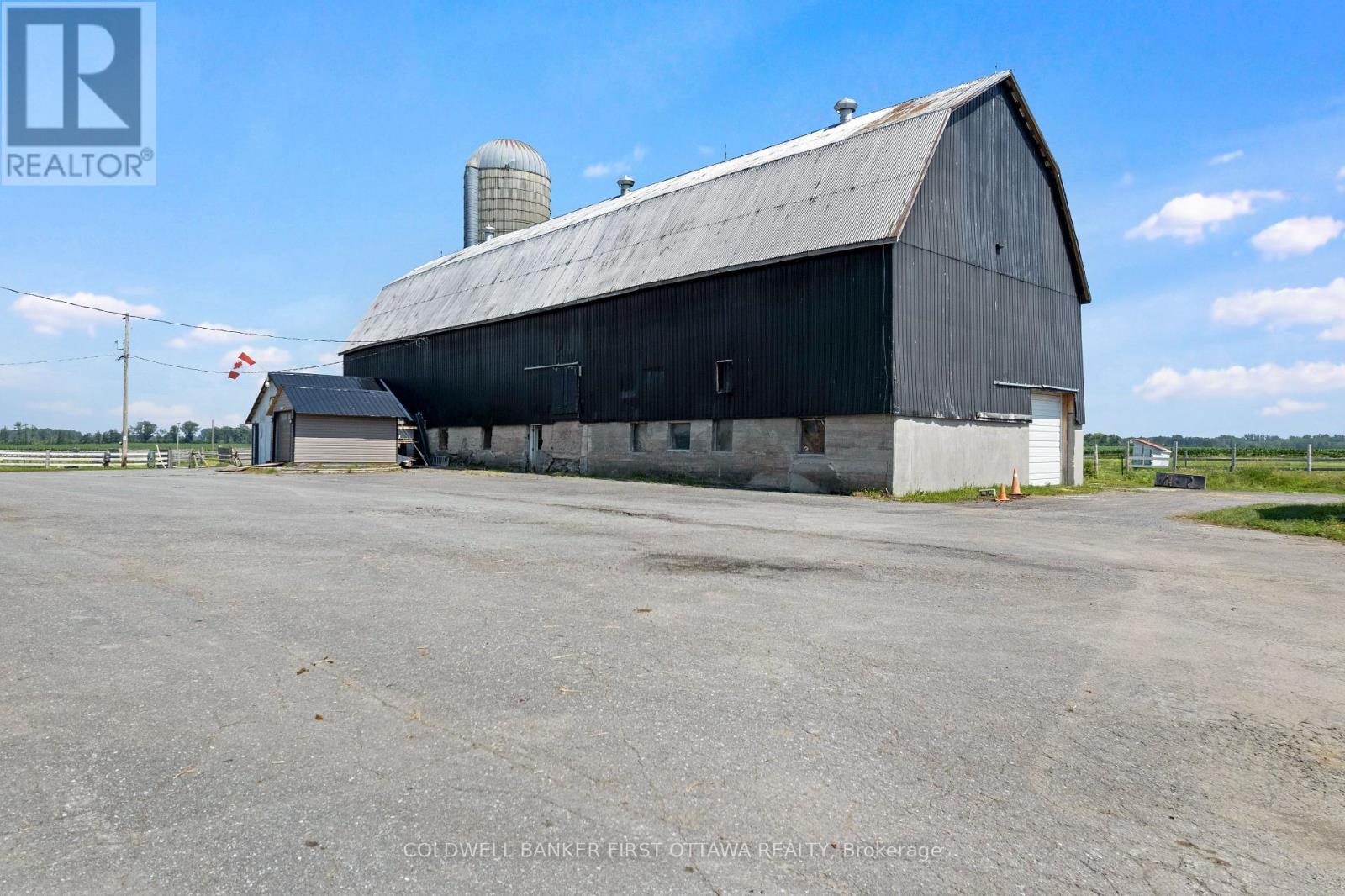 Second horse barn has 9 box stalls & 2 tie stalls