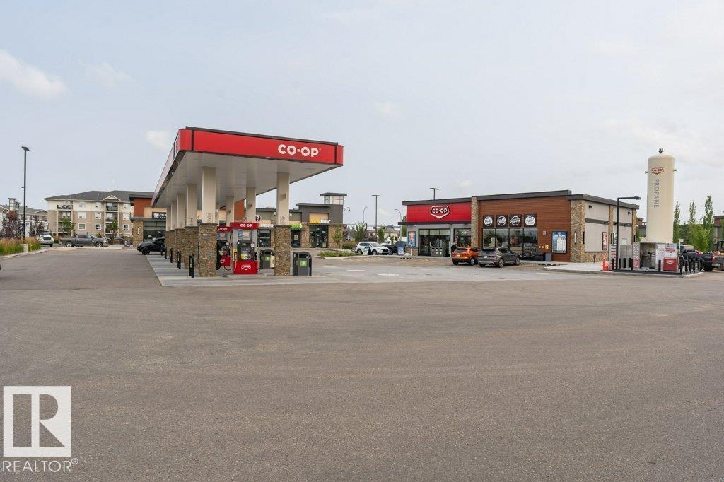 #256 6079 MAYNARD WY NW - 55