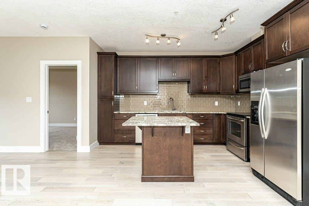 #256 6079 MAYNARD WY NW - 10