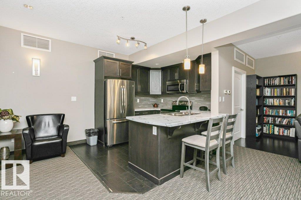 #256 6079 MAYNARD WY NW - 38