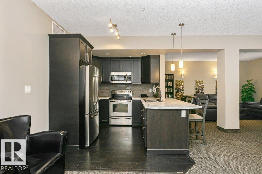 #256 6079 MAYNARD WY NW - 39
