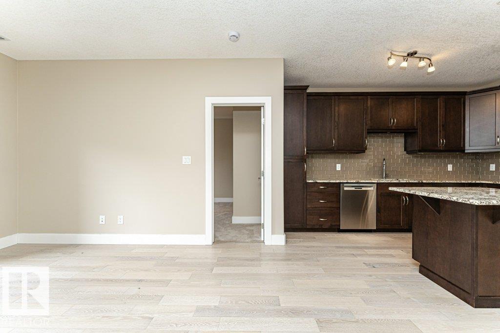 #256 6079 MAYNARD WY NW - 22