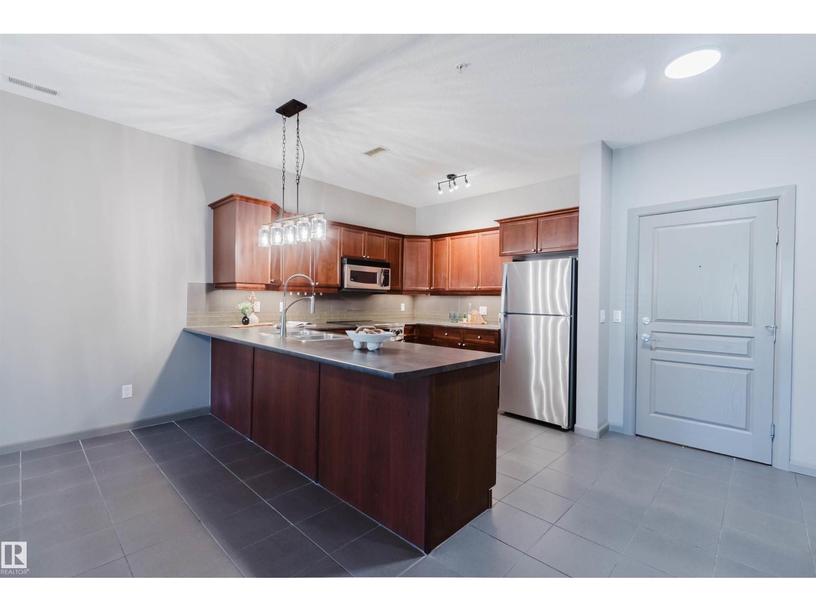 #106 160 MAGRATH RD NW - 13