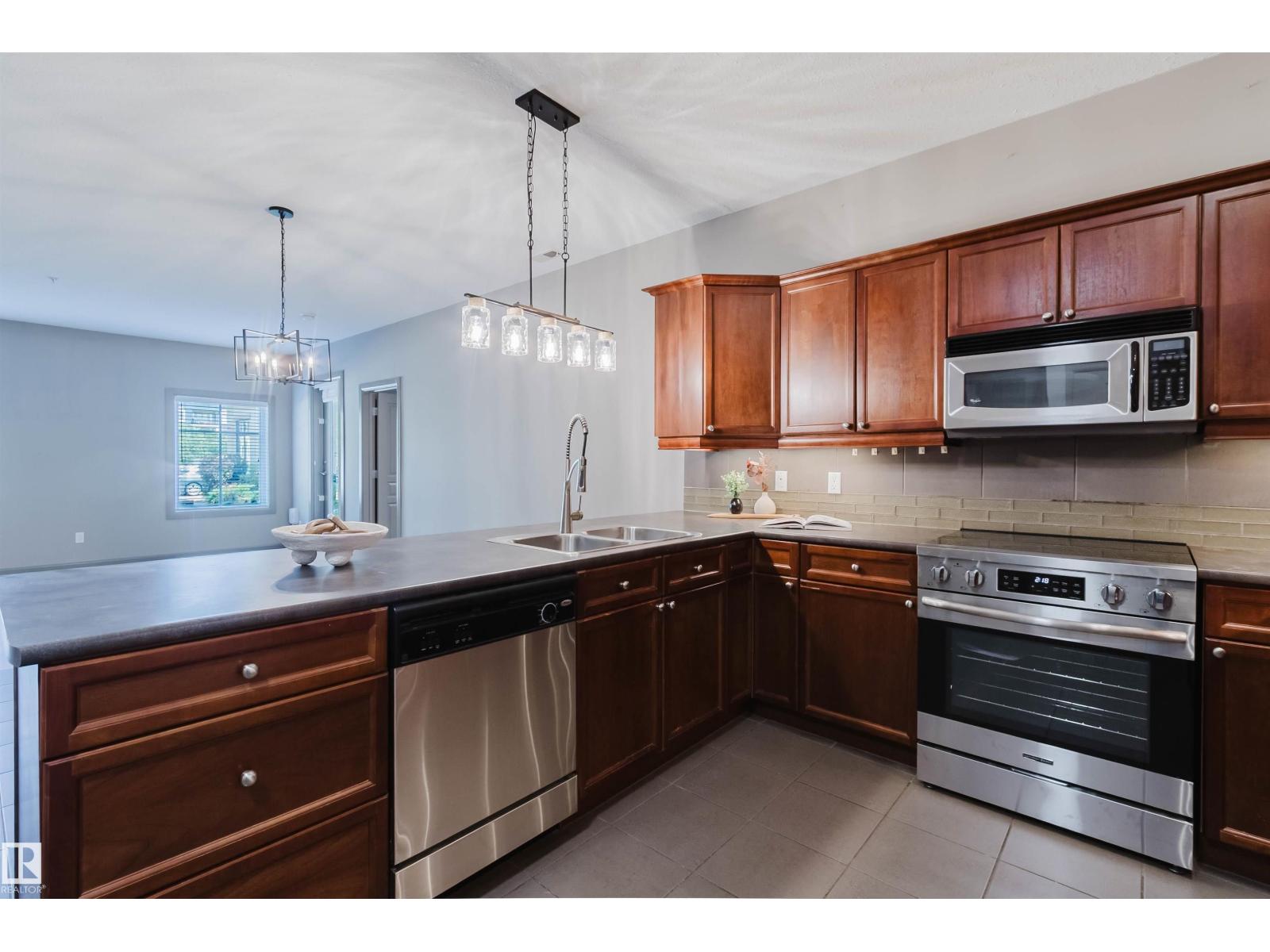 #106 160 MAGRATH RD NW - 17