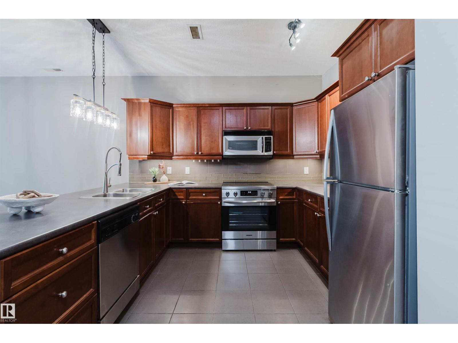 #106 160 MAGRATH RD NW - 16