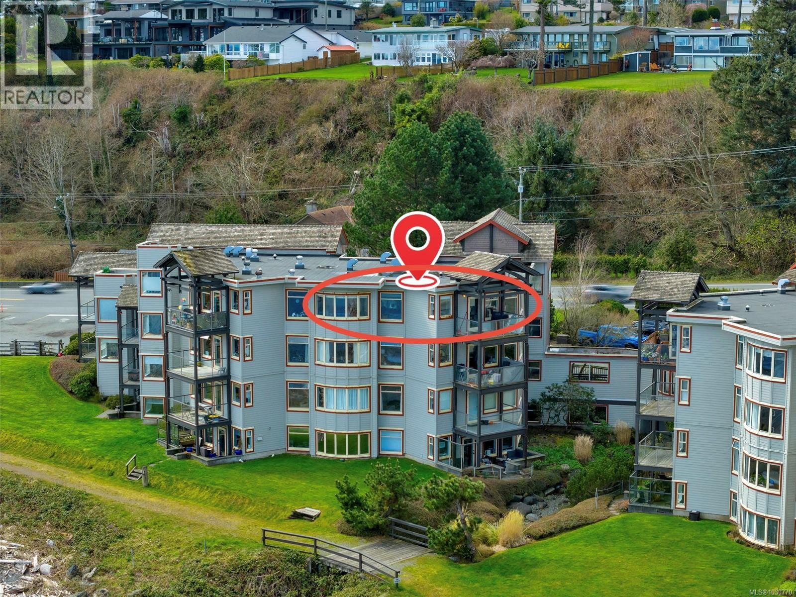 Top Floor Unit - Drone / aerial view of apartment complex / building.