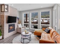 Living room - 205, 106 Stewart Creek Rise, Canmore, AB T1W0N3 Photo 7