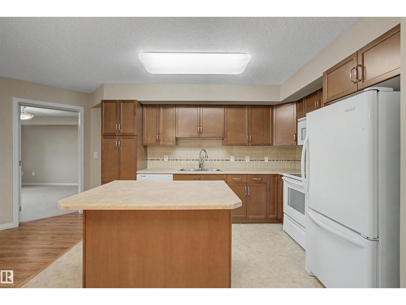 #215 4450 MCCRAE AV NW - 11