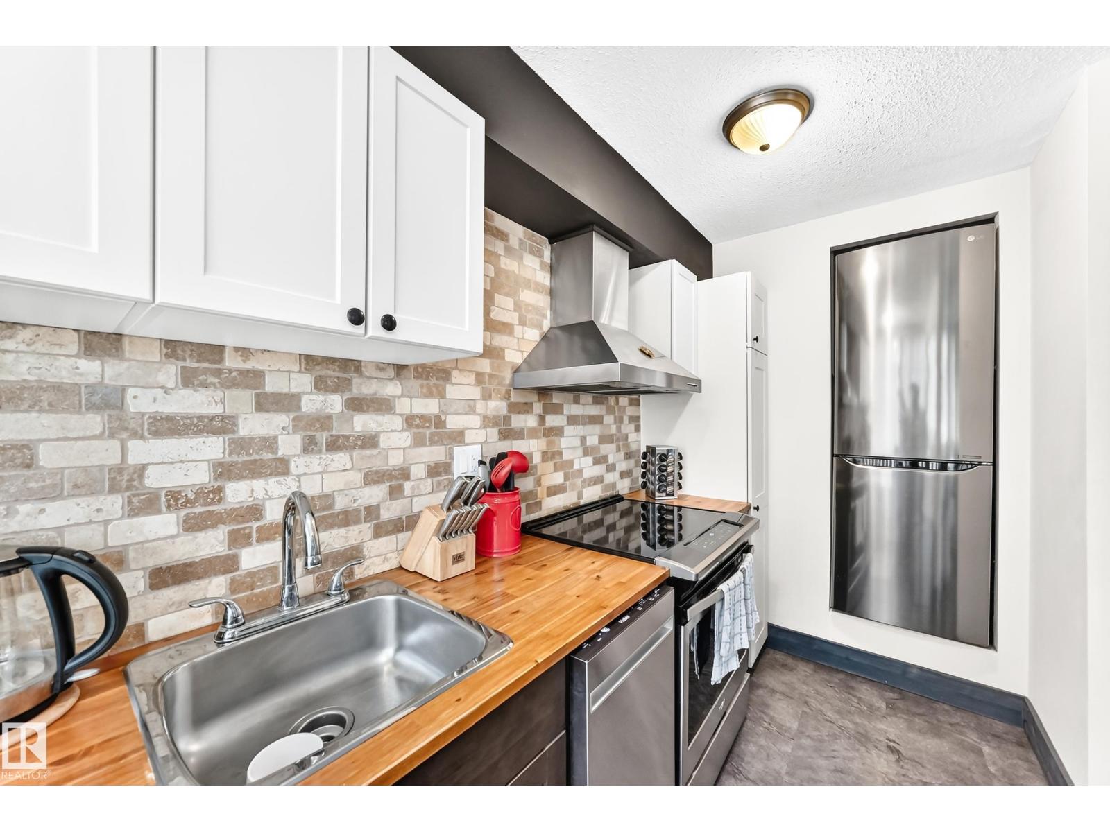 #230 10160 114 ST NW - 1