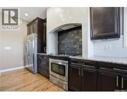 Family room - 102 Thode Avenue, Saskatoon, SK S7W1A1 Photo 13