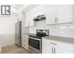 Laundry room - 402, 24 Rivercrest Drive, Cochrane, AB T4C2C8 Photo 9