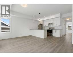 Living room - 402, 24 Rivercrest Drive, Cochrane, AB T4C2C8 Photo 7