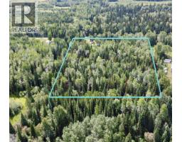 Primary bedroom of 25140 ISLE PIERRE-REID LAKE ROAD · Prince George, BC
