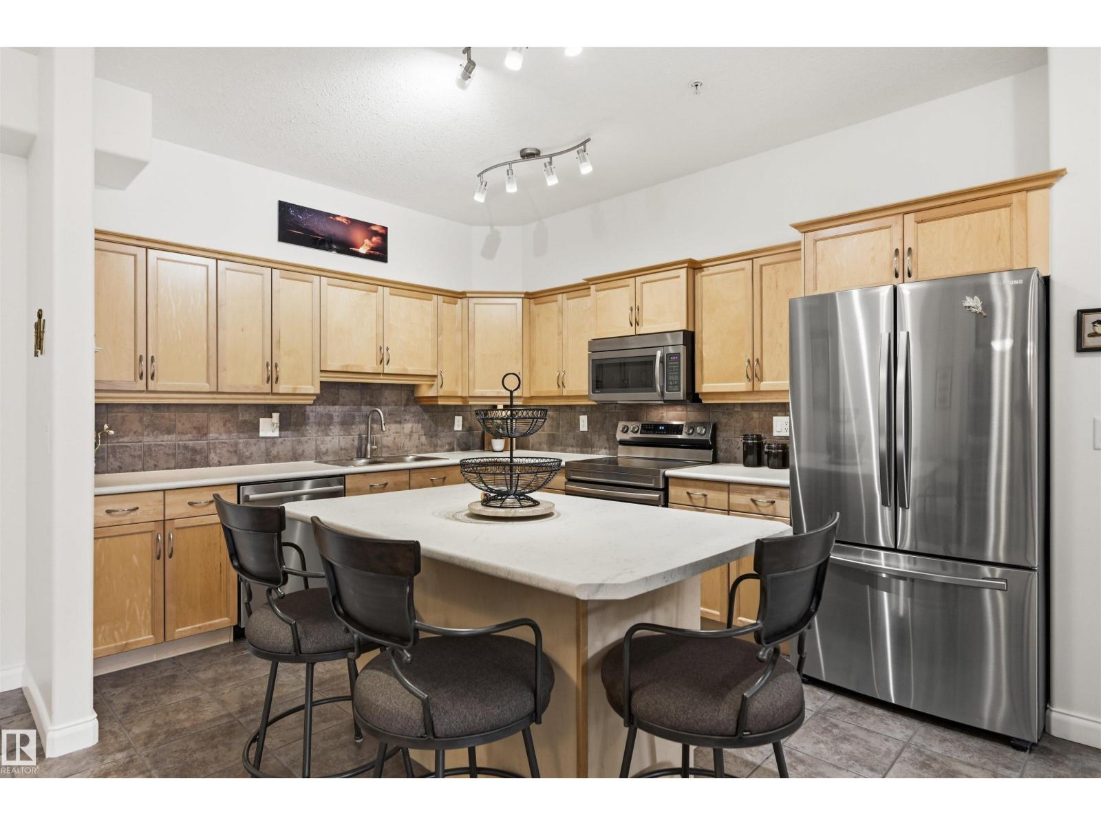 #338 1406 HODGSON WY NW - 3