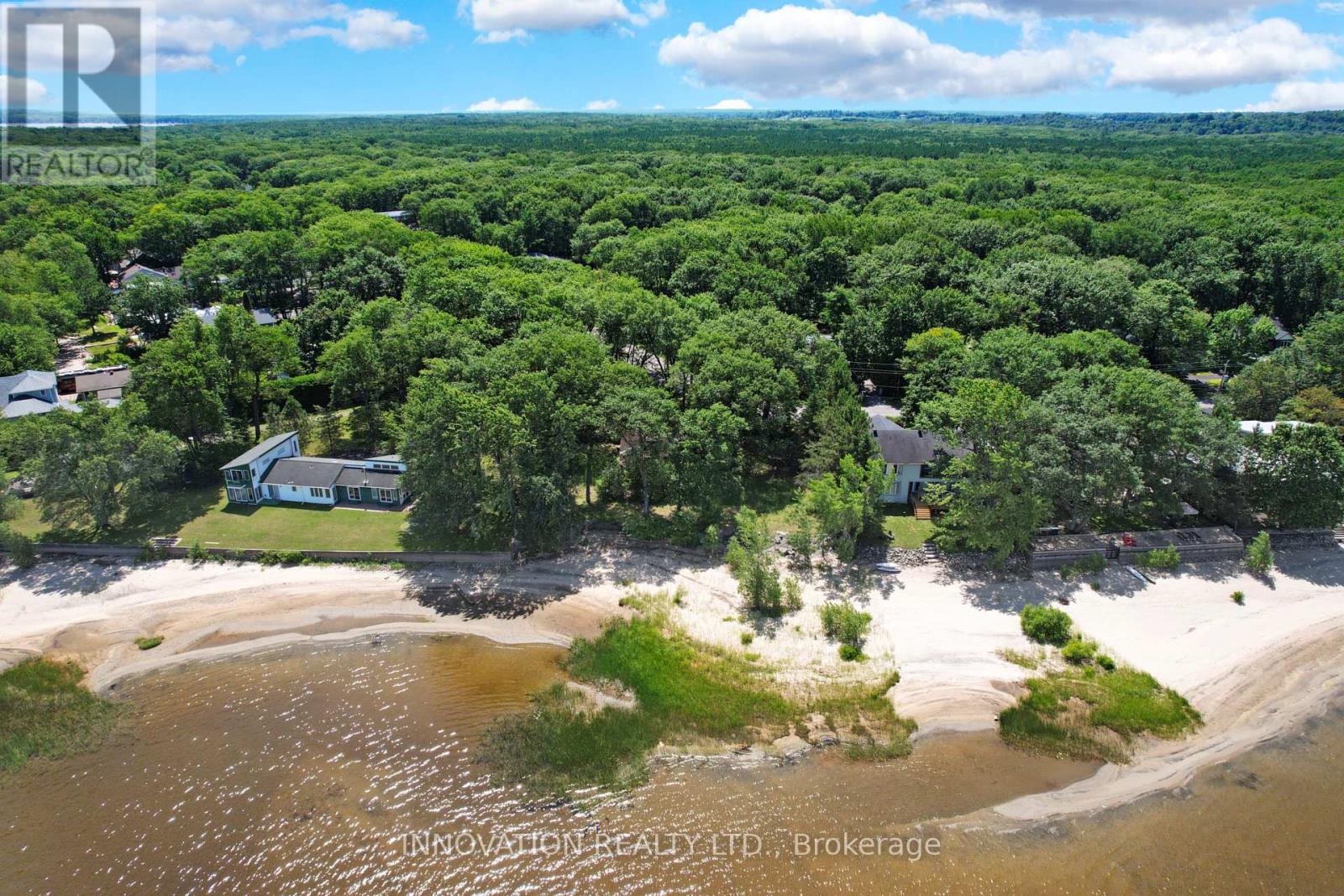 Property is treed area between two houses