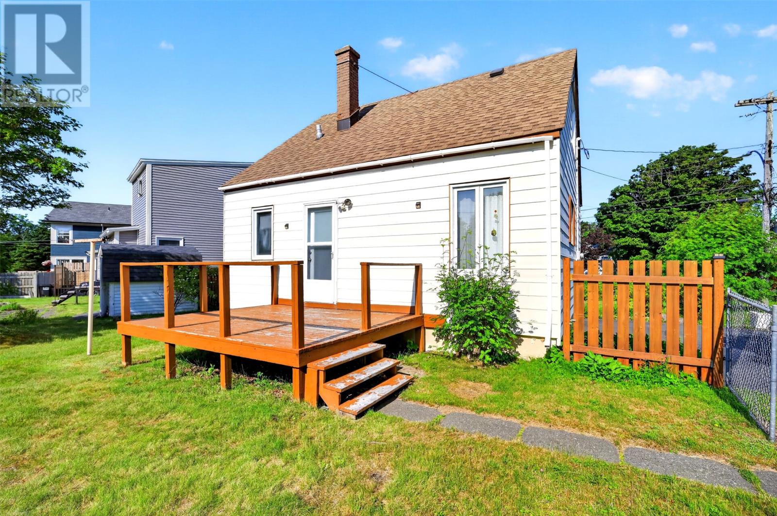 Back deck with full sun overlooking beautiful, private backyard.
