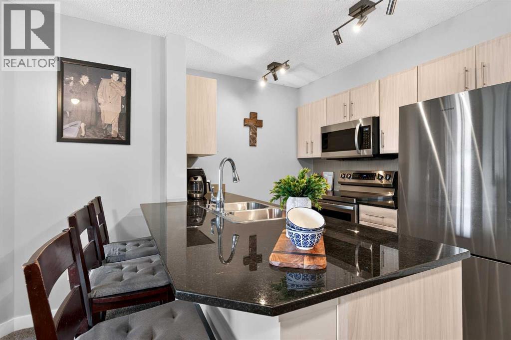 2403, 403 Mackenzie Way SW, Downtown, Airdrie photo 3