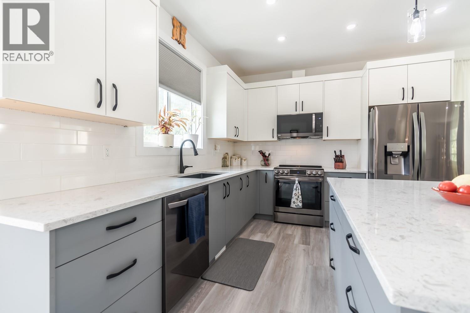 Upstairs Kitchen, Quartz Counter Tops, Tile Back Splash, Soft Close Cabinets