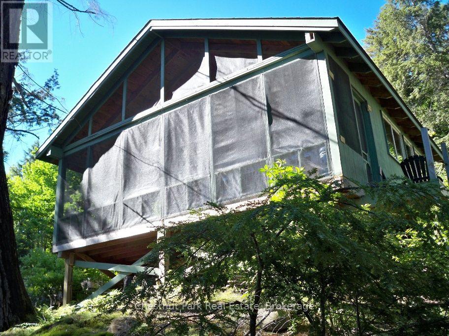Lake side of main cottage with huge screened porch