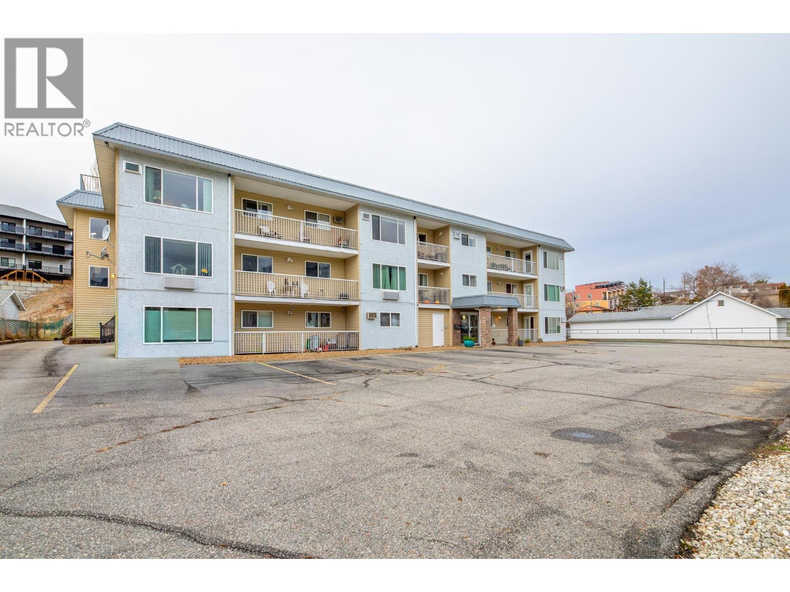 Front of building south side view at 6840 89th st Osoyoos BC with Riccardo Manazza and EXP Realty