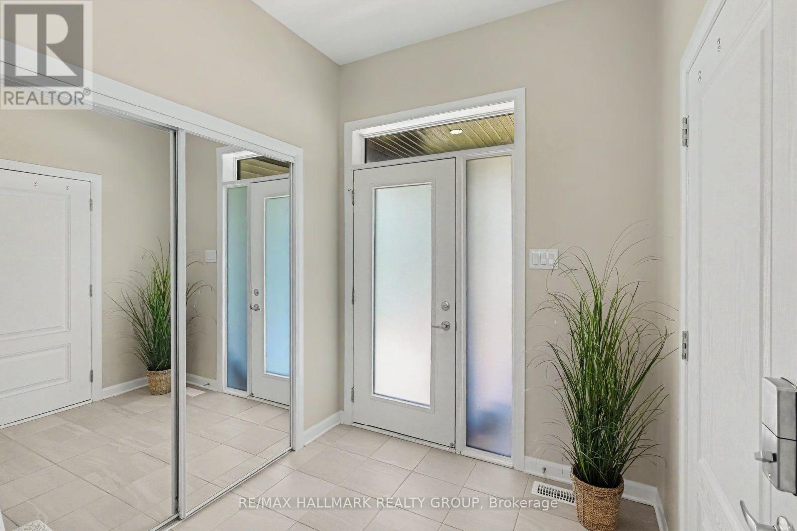 Bright, easy clean tiled entryway.