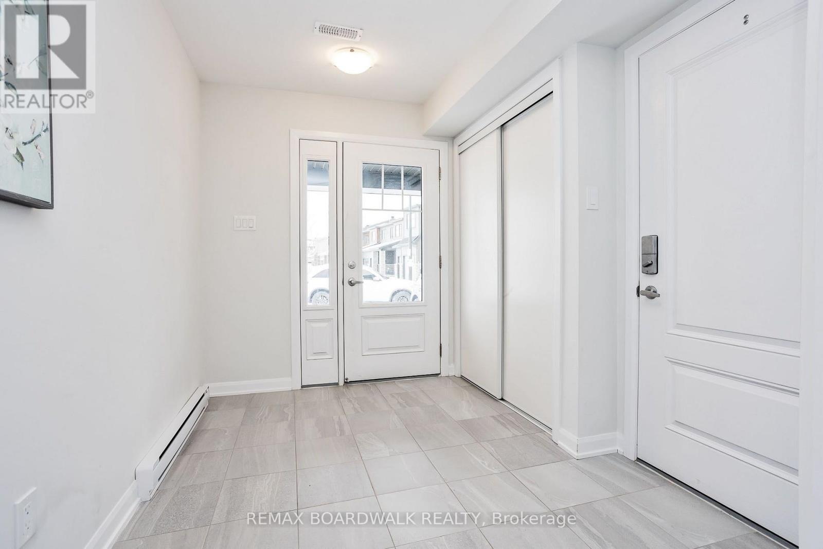 Spacious Tiled Entrance w/Garage Access