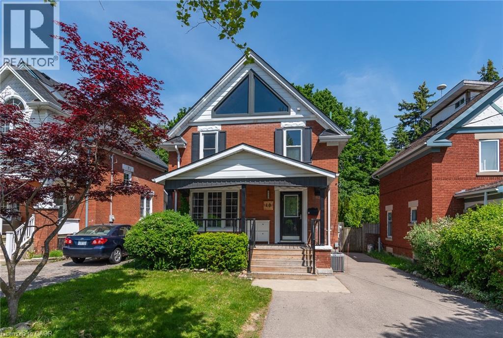 Brick exterior with a prominent front gable featuring an oversized triangular window