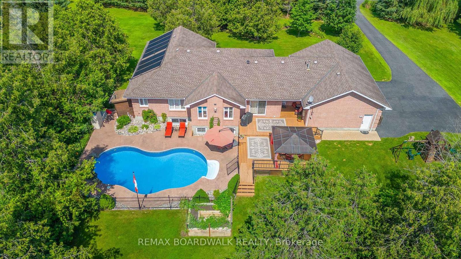 CUSTOM BACKYARD Featuring a Heated Inground Pool
